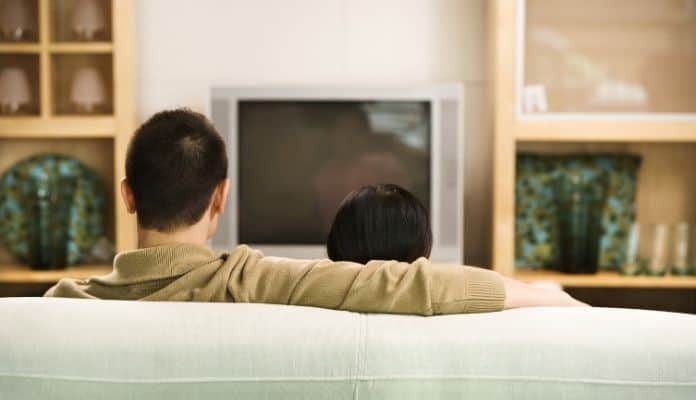 Couple watching a television show
