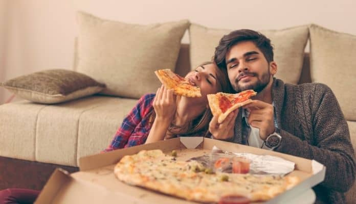 Couple enjoying their pizza